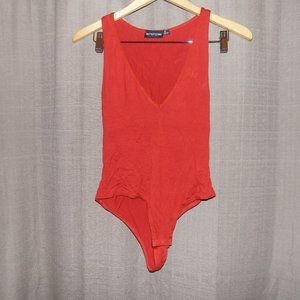 BASIC BURNT ORANGE JERSEY PLUNGE NECK THONG BODYSU